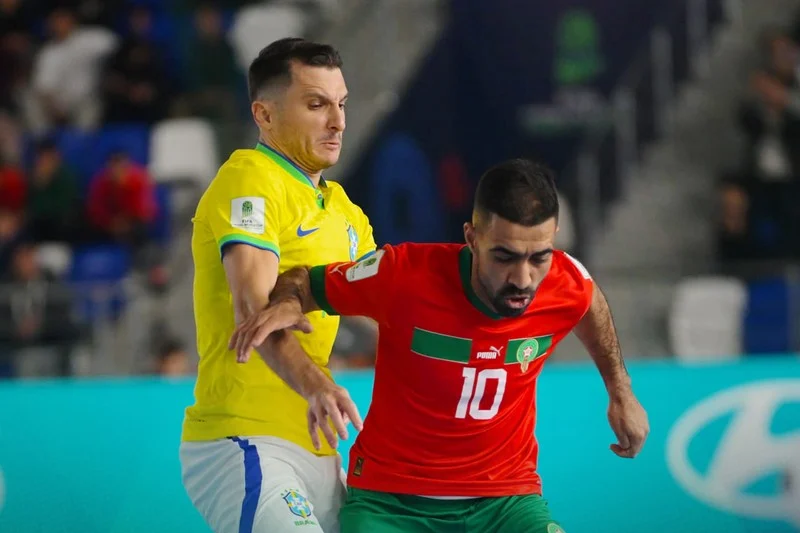 المغرب يودع “مونديال الفوتسال” بعد الهزيمة في ربع النهائي أمام البرازيل<figure class="figure-heading-post" style="box-sizing: border-box; scrollbar-color: var(--sport-primary-color) transparent; scrollbar-width: thin; margin-bottom: 1rem; font-family: hespress-medium, sans-serif; font-size: 16px; font-weight: 400; text-align: right; white-space-collapse: collapse;"><div class="post-thumbnail featured-img" style="box-sizing: border-box; scrollbar-color: var(--sport-primary-color) transparent; scrollbar-width: thin; position: relative; margin-right: 0px; margin-left: 0px;"><div class="ratio-medium" style="box-sizing: border-box; scrollbar-color: var(--sport-primary-color) transparent; scrollbar-width: thin; width: 530px; padding-top: 349.797px; position: relative; overflow: hidden;"></div></div></figure>